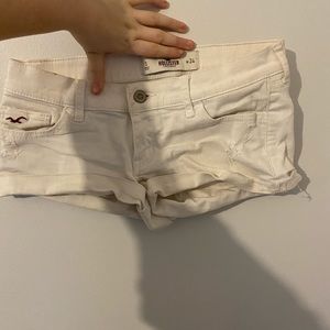 White jean booty shorts. Woman’s size 24